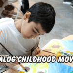 “Child sitting at a table painting with watercolors, illustrating hands-on creative play and the idea of an analog childhood.”